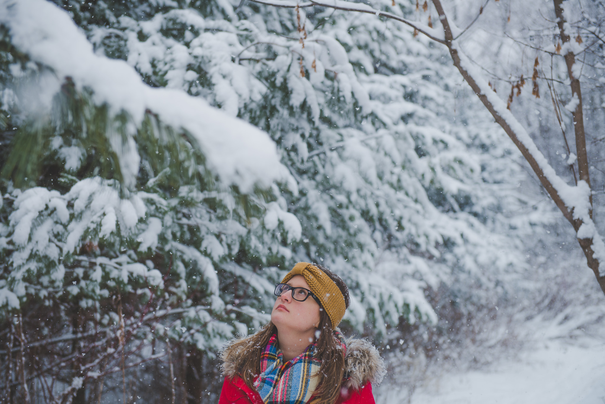 DSC_8115Snow, portrait, woods, red coat, winter, ontario, Canada, Toronto photographer, Port Hope photographer, woman, glasses, woods, trees 