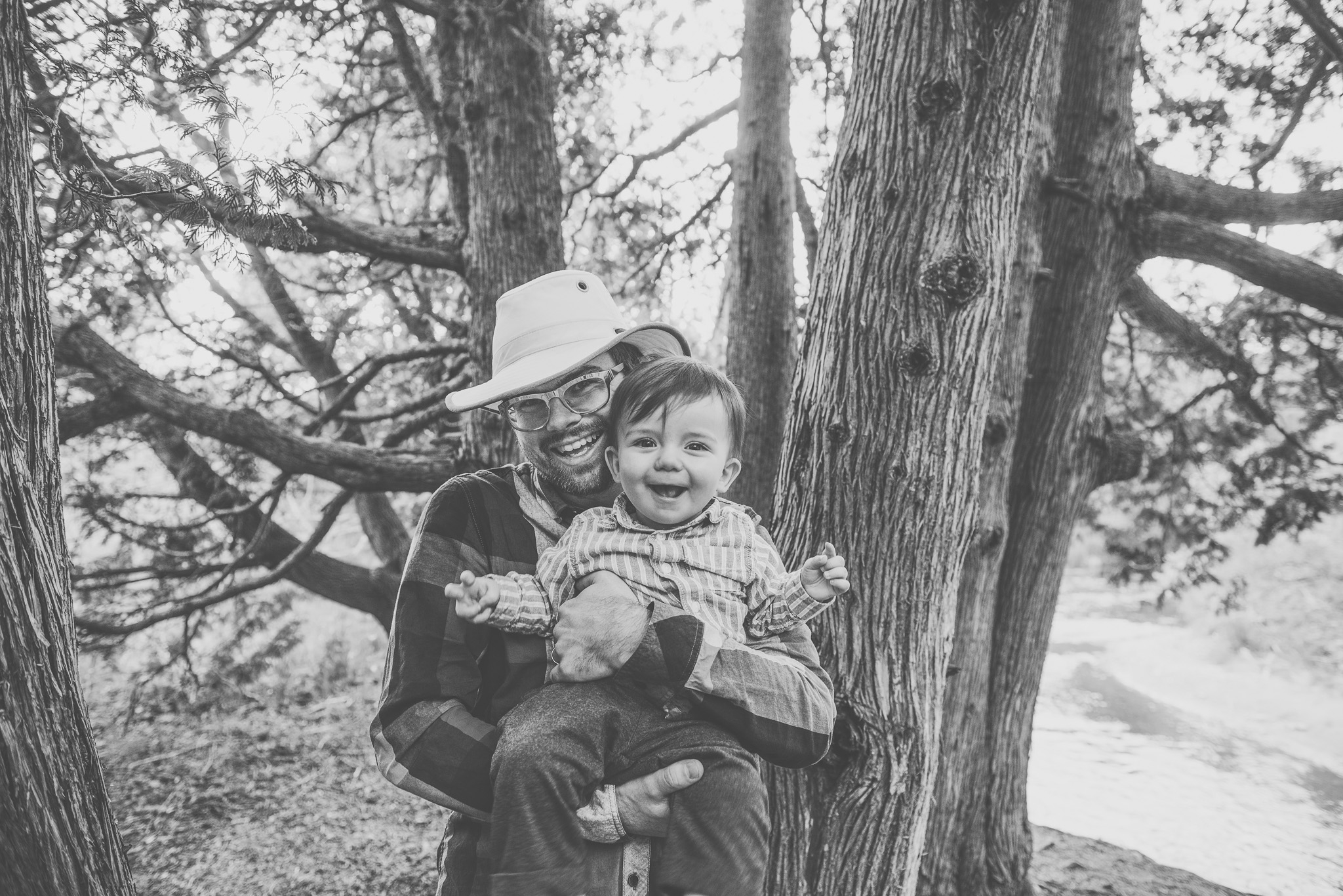 family photography, cobourg ontario, cobourg photographer, port hope photographer, family photographer, family photography, lifestyle photographer, lifestyle photography, toronto photographer, outdoors, woods, sunset, black and white, father and son